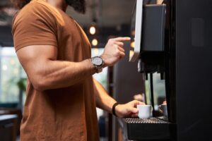 Man filling up coffee cup at an Office Depot Pop Up Fresh Food Offices DC, MA, VA