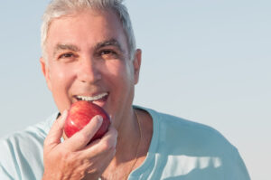 Avenue C Vending MD with a man eating an apple