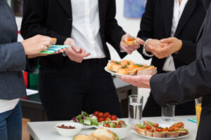 people in the office meeting for appetizers and lunch